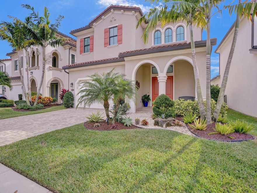 Discover tranquility in this expansive estate, perfectly situated on a premium lot boasting panoramic lake views, unrivaled privacy with no rear-facing neighbors, and a captivating fountain vista. Nestled in prestigious Palm Meadows Estates, this residence showcases the 2,842 sqft. Livingston model, featuring 4 bedrooms and 3.5 baths within an exquisite, open floor plan. Experience the seamless blend of modern, high-end living and resort-style backyard features. As you enter, be greeted by a grand 23-ft ceiling which sets the tone for the home's spacious elegance, complemented by 11-ft ceilings throughout the first floor. Experience culinary sophistication in the contemporary kitchen, showcasing upgraded cabinets, premium stainless-steel appliances with upscale fixtures, a spacious quartz countertop island, and walk-in pantry with custom built in shelving.The grand living space is an ideal spot for hosting, highlighted by 10-foot double sliding glass doors that seamlessly extend to the expansive lanai. The backyard retreat is complete with a heated pool reminiscent of a resort and ample deck space for entertaining. Additionally, the main level features a convenient half bath and guest bedroom with ensuite bathroom.The upper level also includes the master bedroom with spacious his and her walk-in closets featuring custom-built organization for an elevated sense of luxury. The bathroom suite features individual vanities for added comfort, an oversized soaker tub, and shower enhanced by a large rain head. Two additional spacious bedrooms upstairs complete the residence, along with a bathroom featuring a tub/shower unit and dual sinks.Additional features include a 24-hour manned-gated entrance, resort-style living, a multi-million-dollar clubhouse, and a golf cart friendly community. Conveniently located, this sophisticated home offers proximity to A-rated schools, shopping, dining, entertainment venues, major highways, Palm Beach International Airport, Downtown City Place, Worth Avenue, Atlantic Ave, spectacular beaches, and more. Live in luxury without compromise!