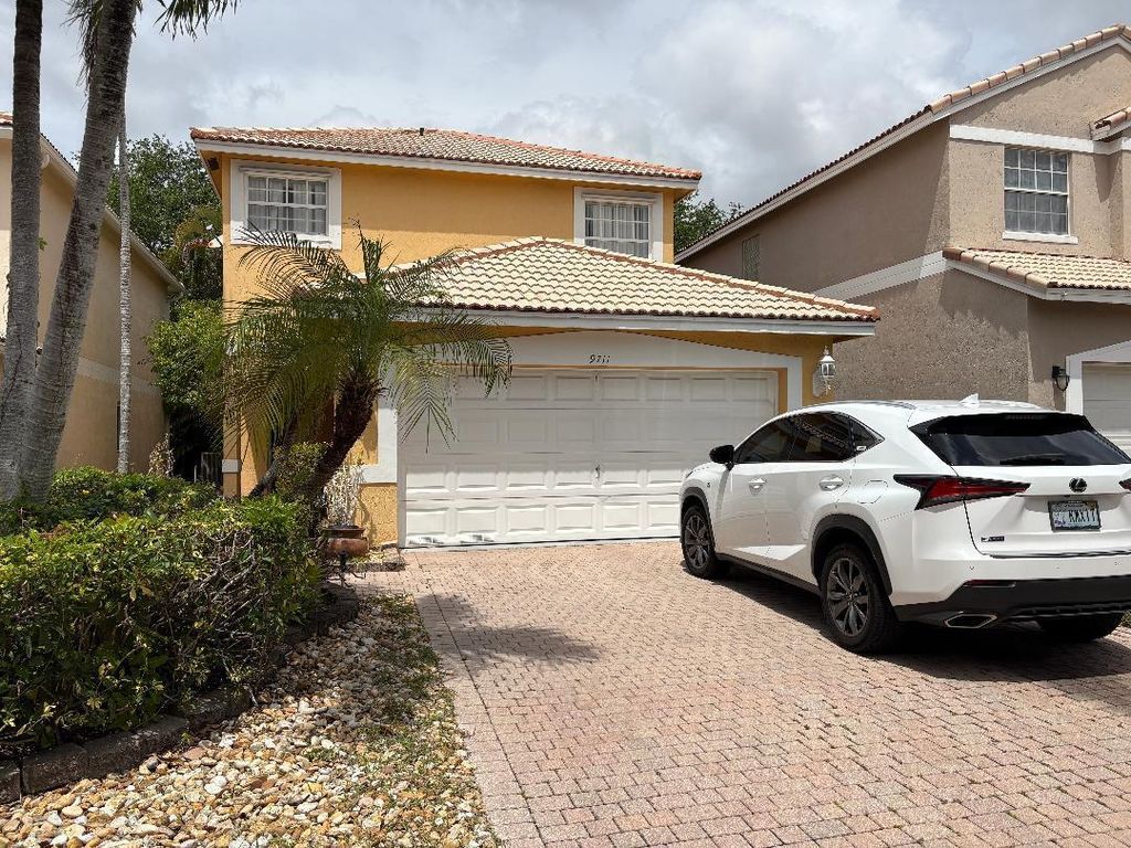 Photo of 9711 NW 2nd Street, Coral Springs, FL 33071 (MLS # B26012506)