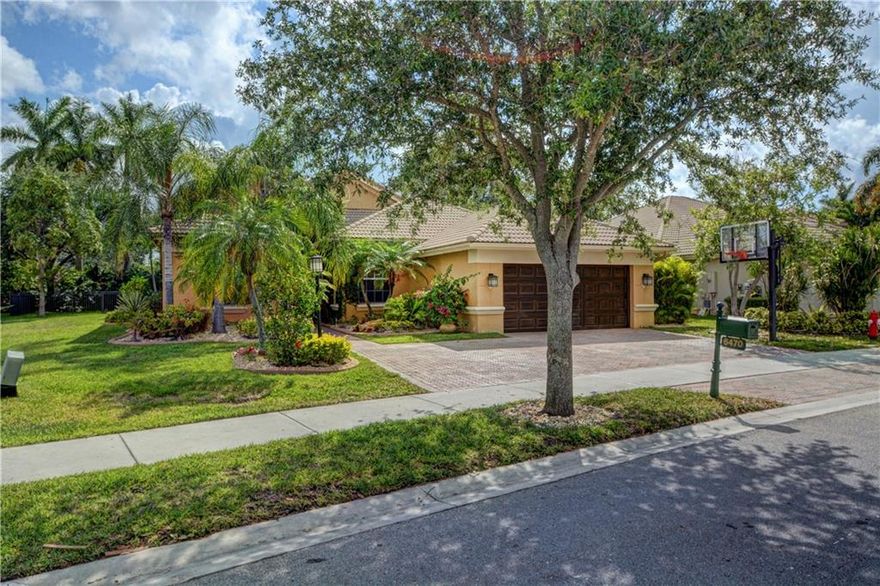 Don't miss out on this lovely 5 Bedroom, 3 Bath pool home in Parkland Isles! Wood flooring and crown moldings through out. Kitchen has quartz countertops, wall oven, stainless steel appliances. Interior was recently painted. The pool and extended paver patio is just over a year old. Wait until you see the beautiful tropical landscaping. Gated community with clubhouse, heated pool & spa tennis courts, basketball, teen room, exercise room plus more. A-rated schools.