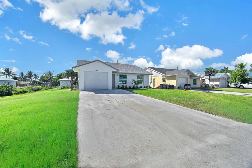 Photo of 5584 SE Katharine Avenue, Stuart, FL 34997 (MLS # R11132696)