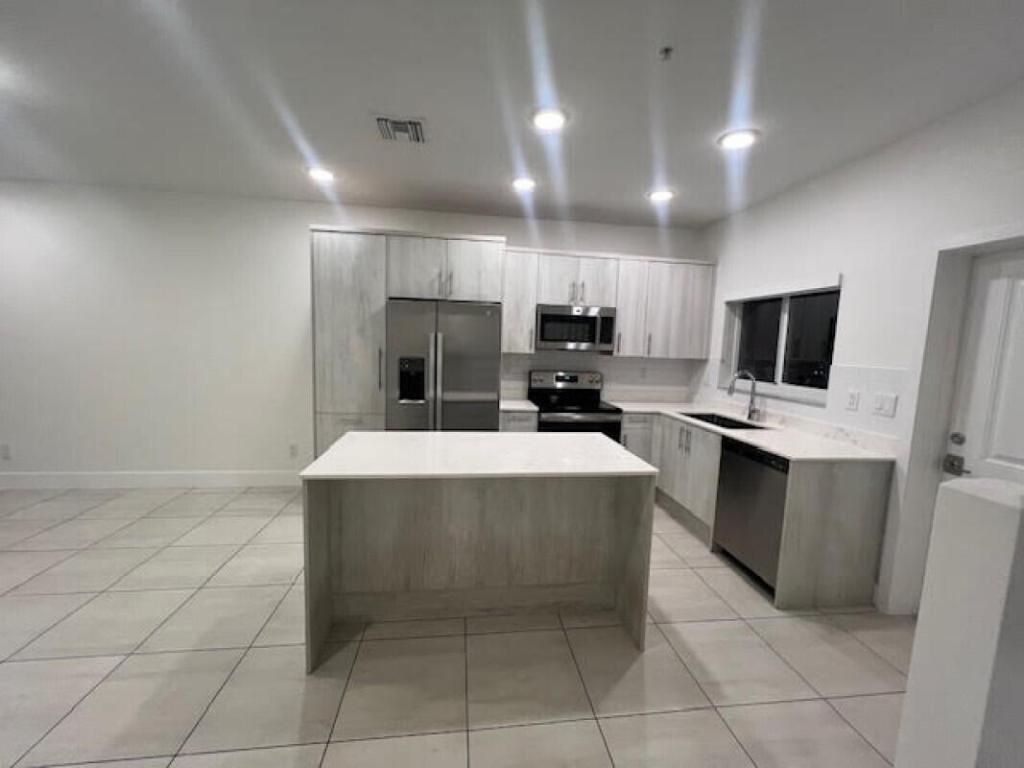 Photo of 3902 Melaleuca Lane #105, Lake Worth, FL 33461 (MLS # R11145027)