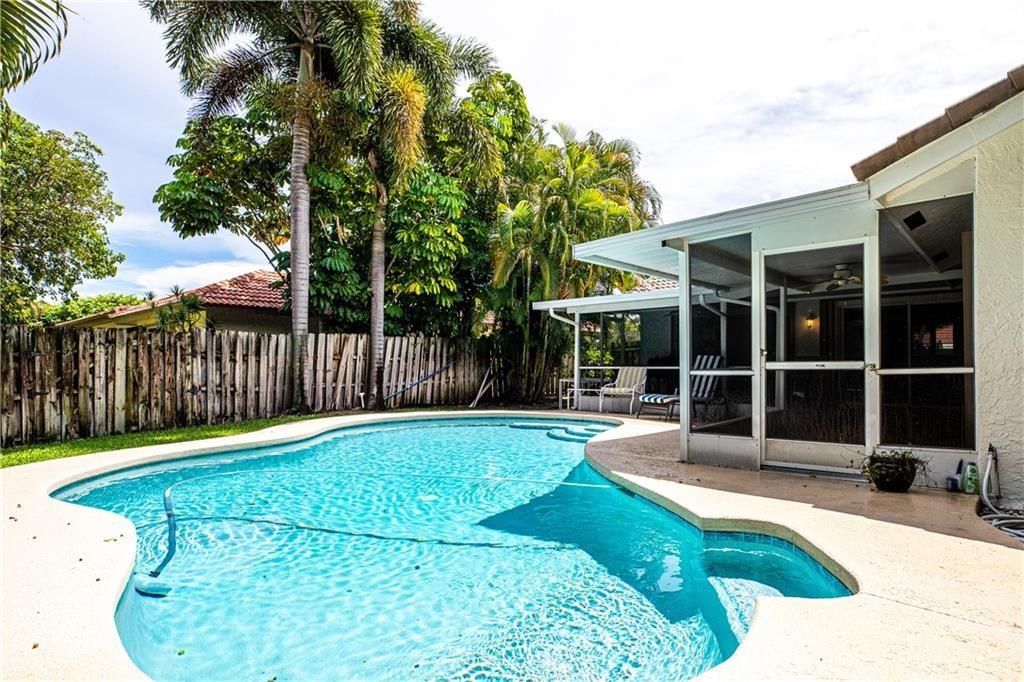 Photo of 411 NW 72nd Street, Boca Raton, FL 33487 (MLS # F10505085)