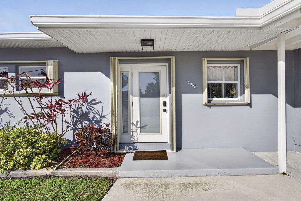 Photo of 2948 SE Treasure Island Road, Port Saint Lucie, FL 34952 (MLS # B26014677)