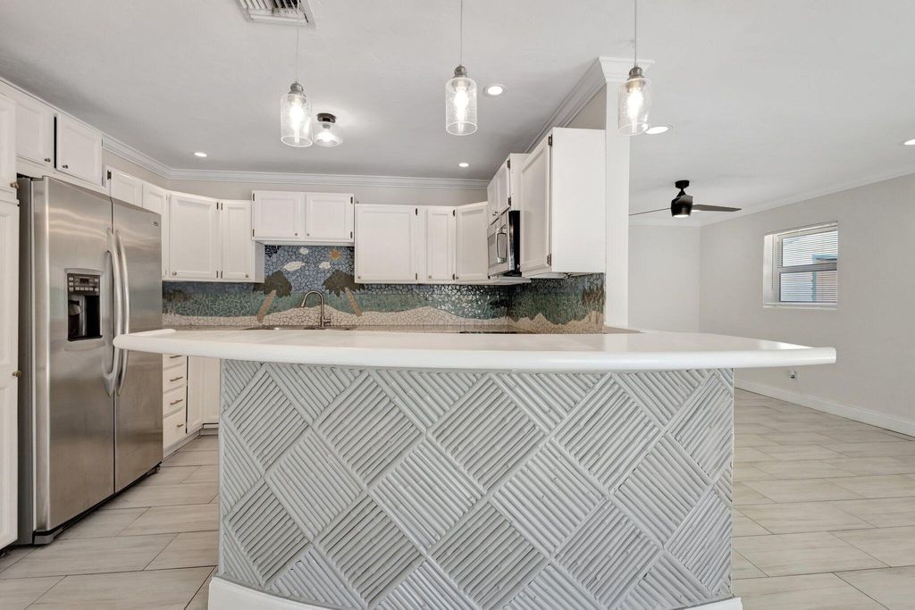 Photo of 1225 16th Ave N #B, Lake Worth Beach, FL 33460 (MLS # R11067378)