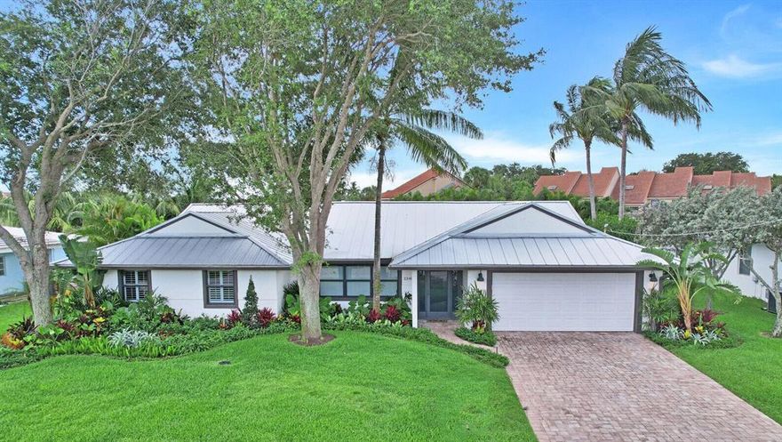 Spectacular deep water with no fixed bridges home with ocean access in the heart of Palm Beach Gardens! Located a few properties away from the Intracoastal, this home epitomizes South Florida Living at its finest. Enter this remodeled 3/2 single-story home and enjoy the vaulted ceilings & expansive open floor plan which flows right into the luxurious backyard. The fantastic backyard features a heated pool, a view of the island preserve, a covered lanai with a tv, an outdoor shower, lush landscaping, the yard is fully turfed, and the pool is surrounded by tiki torches, creating a tropical oasis. The backyard leads you to a newer private dock (2019) which features a 16,000 lb boat lift & is on a deep water canal with no fixed bridges & quick access to the Jupiter Inlets and Palm Beach...