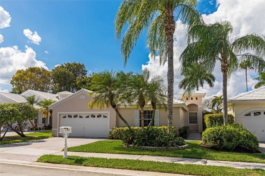 Immaculate Grand Palms one story w partial golf view. Newer 2014 tile roof. Dramatic foyer entry, vaulted ceilings, tiled main living areas, large great room, spacious updated kitchen w beautiful wood cabs & granite counters,  warm, inviting family room overlooks screened patio & golf course on the other side of the berm. Master Suite features 2 closets & large updated bath w skylight & elegant finishes. Full 2 car garage. Close Grand Palms location, not far from gate. HOA inc ext paint,lawn,alarm, cable.