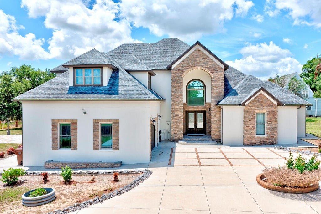Photo of 91 Woodland Drive, Haines City, FL 33844 (MLS # B26032080)