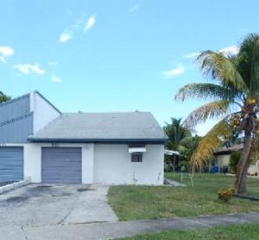 One story corner unit attached villa with attached garage, large yard that backs to small canal. Split bedroom floor plan, atrium that separates the dining area and large family room, eat-in kitchen.  Great for rental or investment.