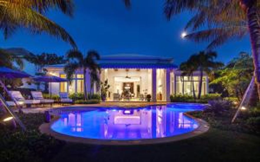 This former Courchene Hamilton model comes professionally decorated and fully furnished. Premium lot with long lake and golf course views located in the Isles Estate Section of Old Palm.  Meticulously crafted and designed, this model has the obvious luxuries like marble flooring, a spacious heated pool with Jacuzzi, and a club room, but also offers high quality in the details, from the kitchen stocked with Thermador appliances, to the phantom screen enclosure. Relax watching the sunset from lanai with outdoor fireplace and summer kitchen. Old palm offers Raymond Floyd Designed golf course and a unique 33 acre Golf learning Studio including a swing analysis. The clubhouse offers both casual and fine dining, a fitness center, a full-service spa and a resort style pool.