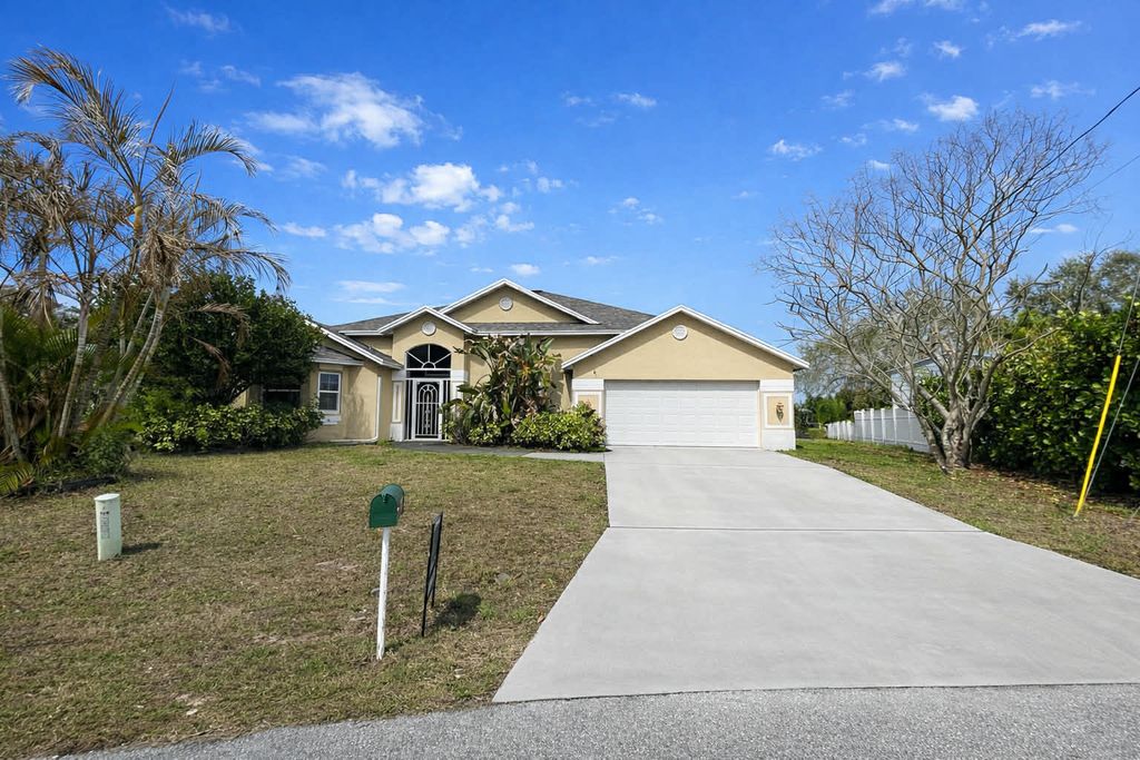 Photo of 301 SW Buzby Court, Port Saint Lucie, FL 34953 (MLS # R11168665)