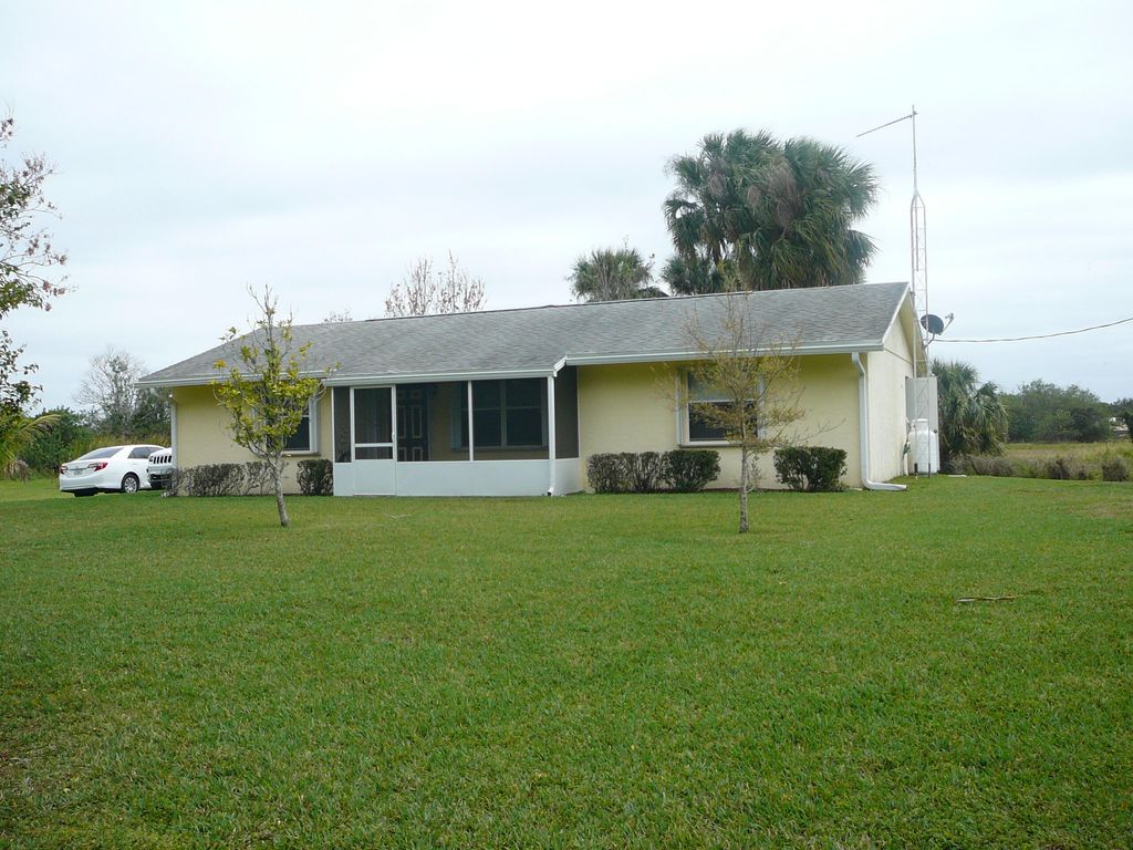 Photo of 7750 Germany Canal Road, Port St Lucie, FL 34987 (MLS # R10867438)