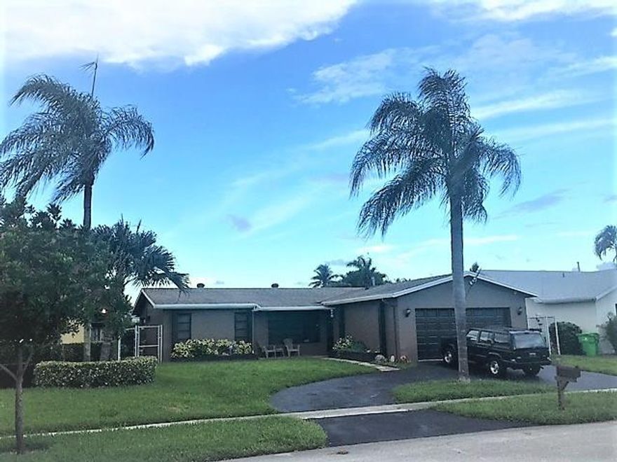 This Single Family home located in the desirable neighborhood of Windward Isle.  Windward Isle is close to world class shopping, many city parks and the Sawgrass Expressway.    The home features a two car garage, updated kitchen and a shingle roof installed in 2012.   Unfortunately, the flat roof which was not replaced in 2012, has a leak and has caused damage to the ceiling in the Florida Room.