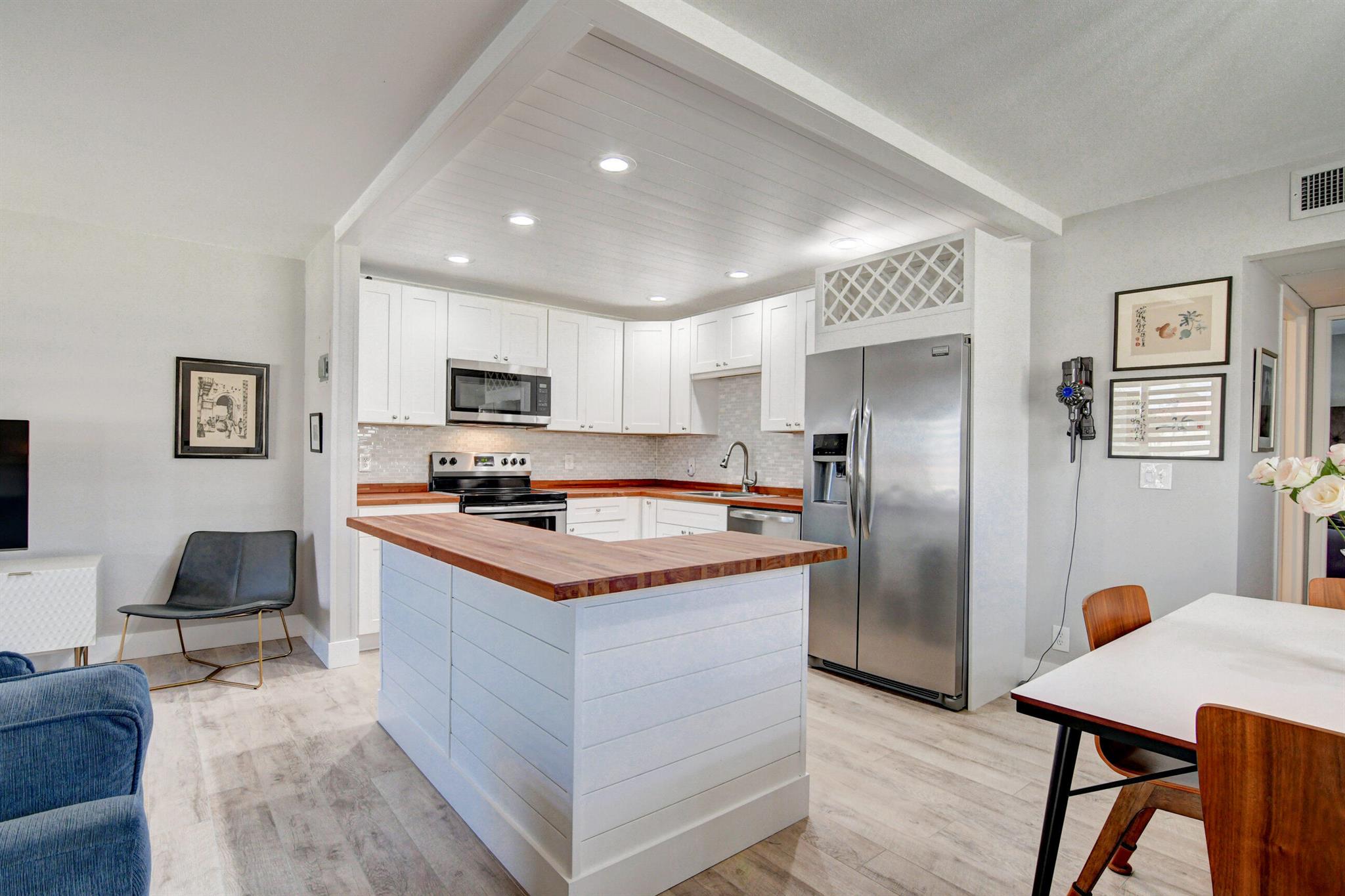 SHORT SALE Enjoy the best of 55+ living in this renovated, move-in-ready second-floor condo in the sought-after Kings Point Active Adult Community. This stylish home features modern faux wood flooring, updated fixtures, and a sleek open-concept design. The spacious owner's suite boasts a large custom-organized closet and a remodeled en-suite bathroom.Relax in the enclosed Florida room, perfect for extra seating, dining, or entertaining. The updated kitchen shines with butcher block countertops and contemporary finishesKings Point offers resort-style amenities, including two 18-hole golf courses, pools, tennis courts, an exercise studio, and a state-of-the-art theater hosting spectacular shows. Enjoy on-site cafes, social events, educational programs, and a courtesy shuttle.AC '22 WH'23
