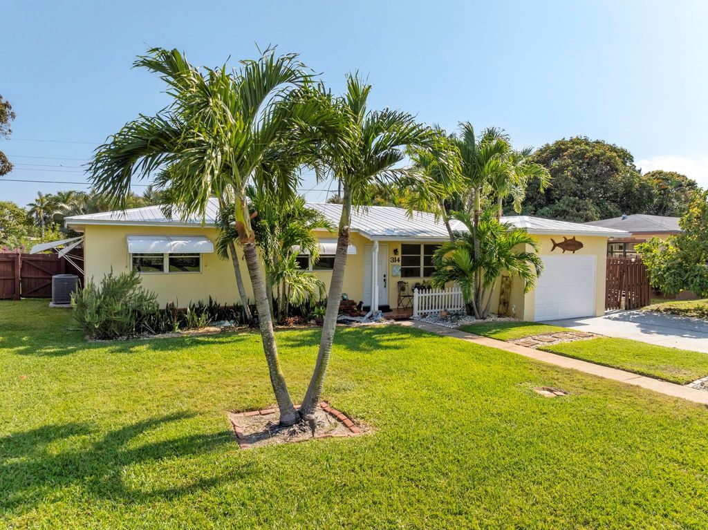 Photo of 314 E Jasmine Drive, Lake Park, FL 33403 (MLS # R11082479)