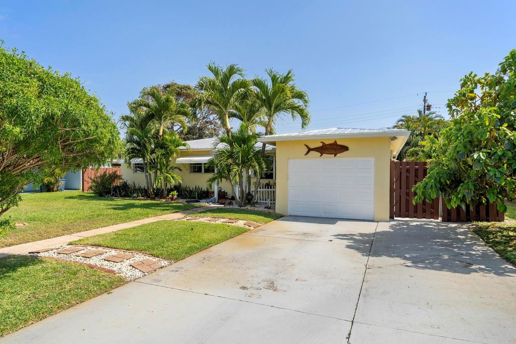 Photo of 314 E Jasmine Drive, Lake Park, FL 33403 (MLS # R11082479)