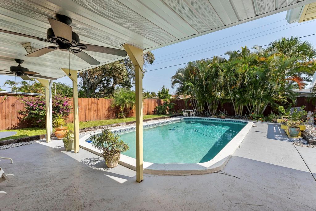 Photo of 314 E Jasmine Drive, Lake Park, FL 33403 (MLS # R11082479)