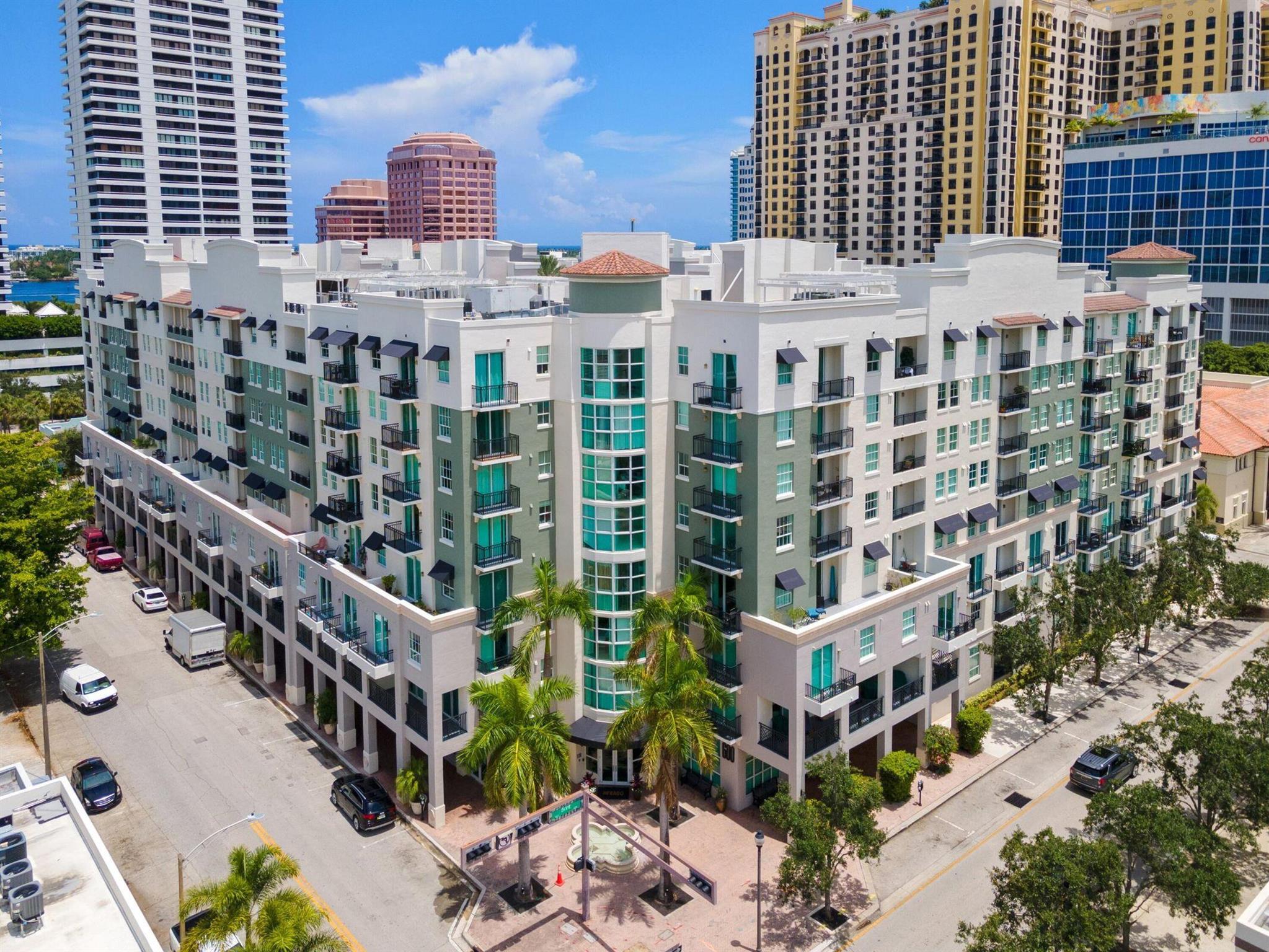 Bask in wonderful light and southern exposure from this elegant high-floor residence at The Prado, where a glimpse east from the balcony reveals sparkling Intracoastal views. Designed with a split floor plan, this home boasts two private master suites, each offering comfort and style. The open-concept layout is anchored by a gourmet kitchen with European cabinetry and granite countertops, seamlessly flowing into the sunlit dining and living areas--perfect for entertaining or simply relaxing. The primary suite features its own private balcony, a custom walk-in closet, and spa-like comfort. Just steps from the elevator, this home offers both convenience and privacy.