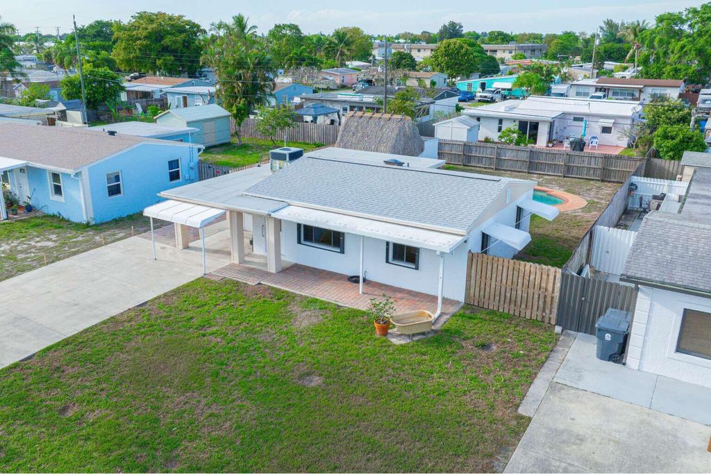 Photo of 3110 Scanlan Avenue, Lake Worth, FL 33461 (MLS # B26010230)