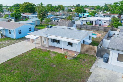 Tiny photo for 3110 Scanlan Avenue, Lake Worth, FL 33461 (MLS # B26010230)