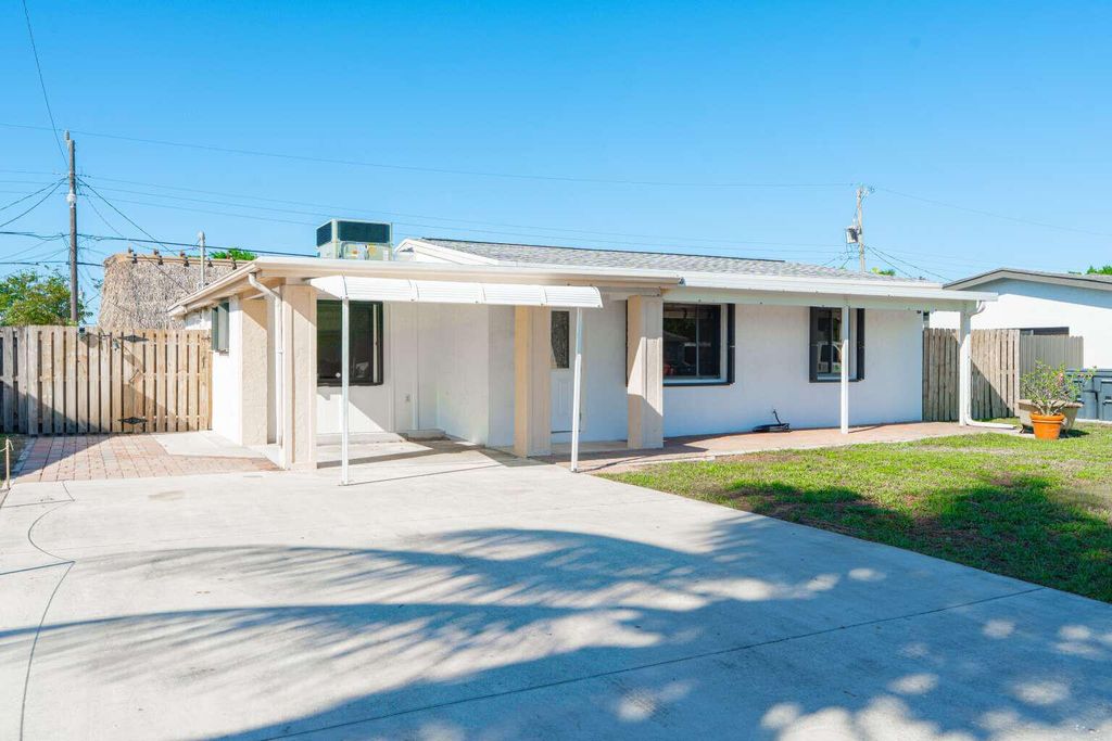 Photo of 3110 Scanlan Avenue, Lake Worth, FL 33461 (MLS # B26010230)