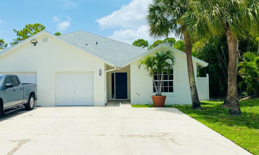 Spacious 4 bedroom/3 bathroom duplex with fenced backyard on a canal and no HOA! Features cathedral ceilings, stainless steel appliances, and a large open layout. Move-in ready!