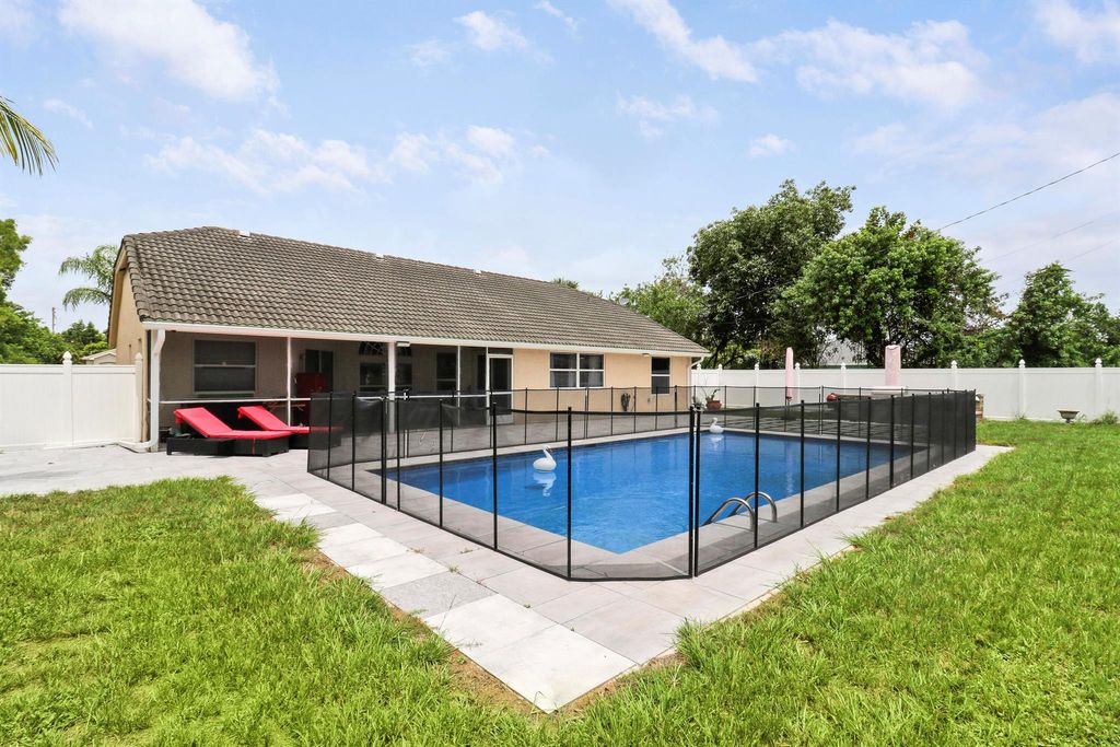 Photo of 2962 SW Coastal Terrace, Port Saint Lucie, FL 34953 (MLS # R10999721)