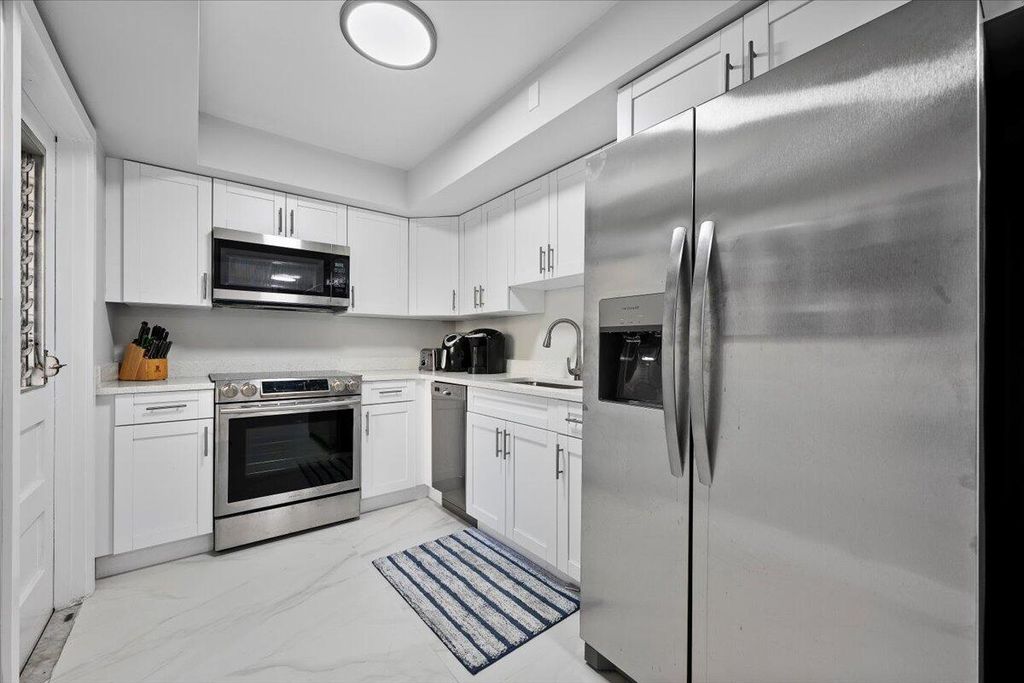 Photo of 5500 Tamberlane Circle #105, Palm Beach Gardens, FL 33418 (MLS # R11140876)