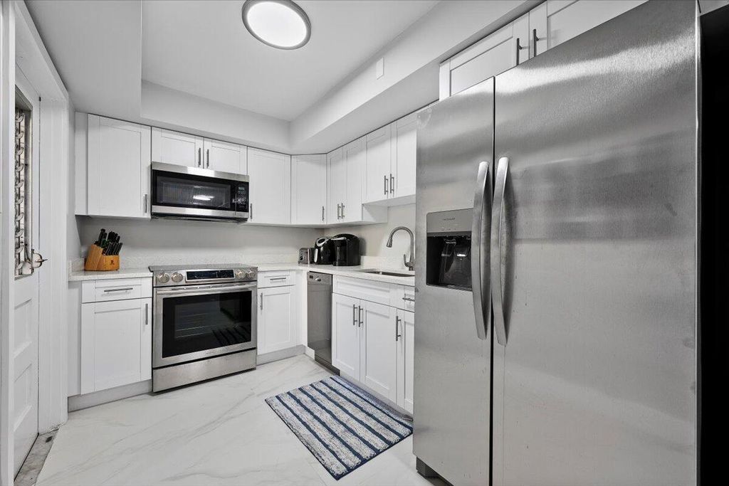 Photo of 5500 Tamberlane Circle #105, Palm Beach Gardens, FL 33418 (MLS # R11140876)