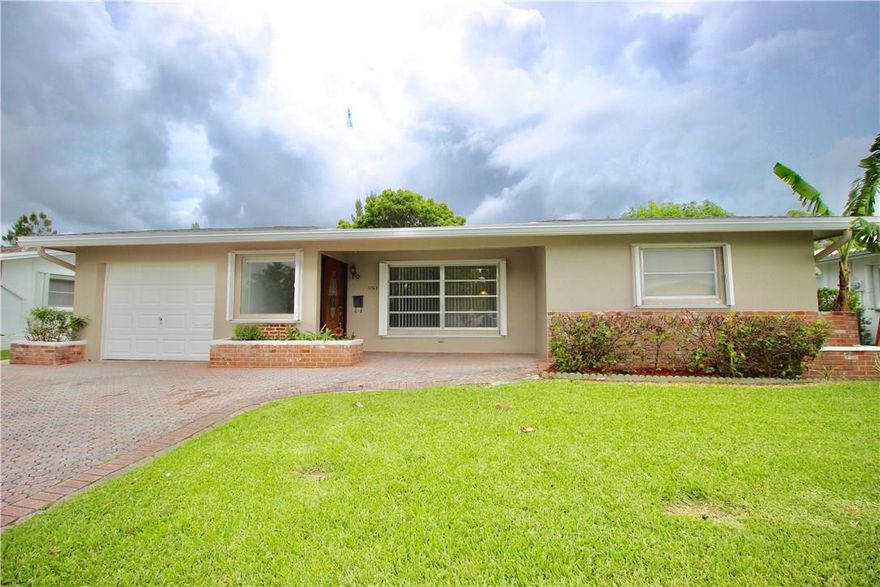Spacious and Bright 2 Bedroom 2 Bathroom Home With 1 Car Garage. This WATERFRONT Home Features Beautiful Canal Views From Oversized Bonus Room/Den and Open Patio. Featuring Newer A/C Unit, Shutters Throughout, Newer Roof, Beautiful Kitchen Featuring Granite Counter Tops And New Stainless Steel Appliances, Porcelain Tile Throughout Main Living Areas, Wood Flooring In Bedrooms, Modern Tile And Granite Tops In Bathrooms And Brick Paver Double Wide Driveway. Will Not Last! Super Low HOA Fee.