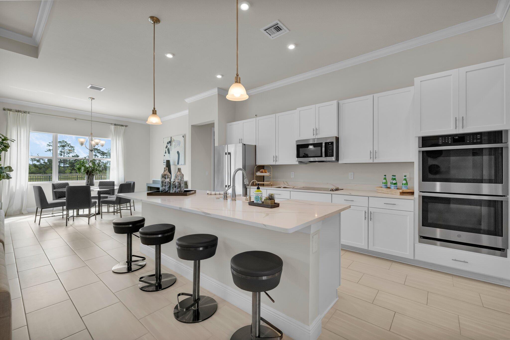 Welcome to your dream home in beautiful Banyan Bay! This stunning one-story residence offers 3 bedrooms and 2.1 bathrooms, perfectly designed for comfort and style. You'll be greeted by soaring natural light streaming through impact windows, creating a warm and inviting atmosphere.The kitchen is a true centerpiece, featuring gleaming granite countertops, stainless steel appliances, rich wood cabinetry, and a spacious pantry. The expansive master suite is your own private retreat, with a spa-like bathroom and an impressive walk-in closet.The property has been staged for photography purposes only and is currently vacant.As a resident of Banyan Bay, you'll also have access to amazing amenities, including a clubhouse, resort-style pool, and fitness center. Conveniently located near 95