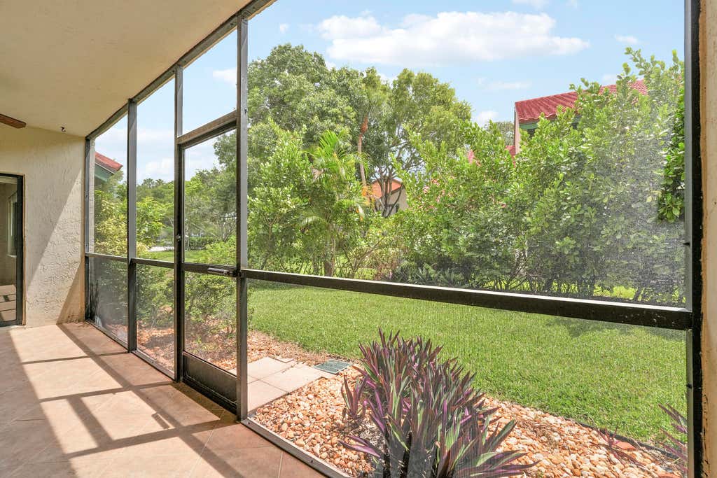 Photo of 13 Lexington Lane E #A, Palm Beach Gardens, FL 33418 (MLS # B26064181)