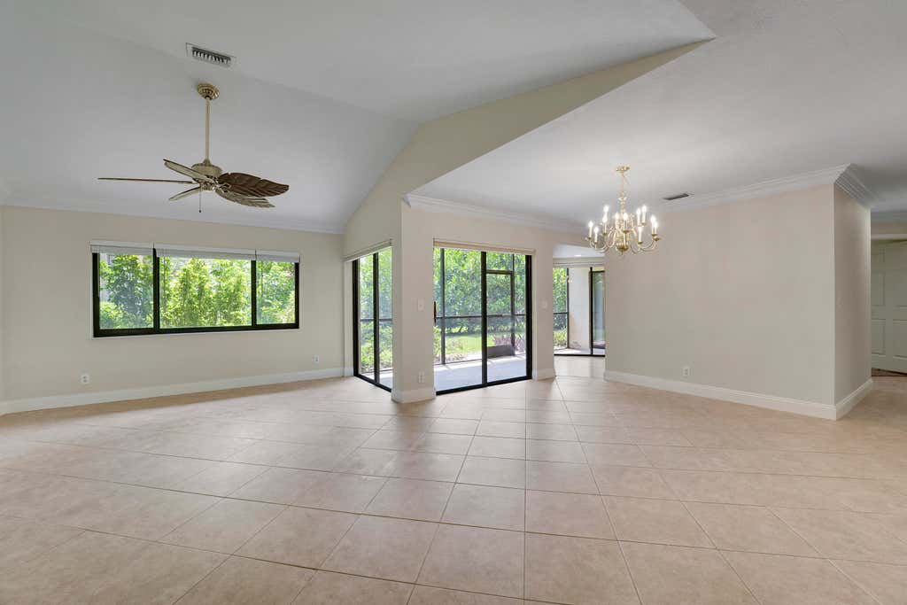 Photo of 13 Lexington Lane E #A, Palm Beach Gardens, FL 33418 (MLS # B26064181)