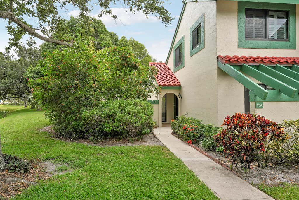 Photo of 13 Lexington Lane E #A, Palm Beach Gardens, FL 33418 (MLS # B26064181)