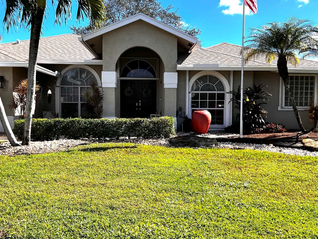 Photo of 108 Locust Lane, Royal Palm Beach, FL 33411 (MLS # R10925545)