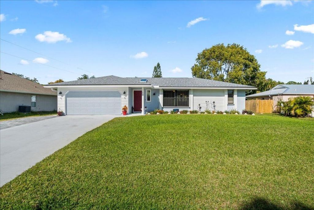 Photo of 761 SE Cavern Avenue, Port Saint Lucie, FL 34983 (MLS # R11055029)