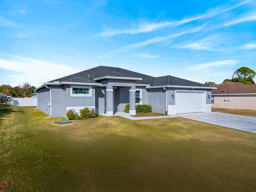 Absolutely pristine home that truly shows like a model! This beautifully maintained 3-bed, 2-bath residence offers 2,155 sq ft of spacious living, an open floor plan, and timeless curb appeal on a generous 10,454 sq ft lot in desirable Port Saint Lucie. Built in 2018, this home features an attached garage, quality construction, and thoughtful design throughout. Enjoy the comfort of modern living PLUS energy-saving roof insulation to help keep your electric bills lower. Perfect for everyday living or entertaining, this home blends style, efficiency, and move-in readiness -- don't miss your chance to call it yours!