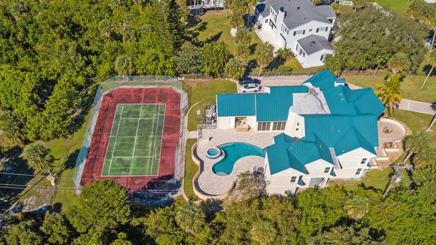 Introducing 3343 S Indian River Dr, this breathtaking estate , measuring 7,400 sq ft under A/C, is set back on a 3.5 acre lot of private riverfront land with 151 feet of waterfront. The views are amazing, you'll be just 8 minutes away from the deep-water marina's and 10 minutes from the ocean inlet. The estate offers five bedrooms with the option for eight, 5.5 bathrooms, a safe room, a game room, a media room, and a full-size sauna.  The main entrance features custom stained glass doors, a parlor room, a formal dining room with a two-sided fireplace, a family room with a high-soaring ceiling, an office, a breakfast nook, and a large chef's kitchen. The home was completely renovated in 2009, featuring impact-resistant windows and doors, a metal roof, new tile floors,