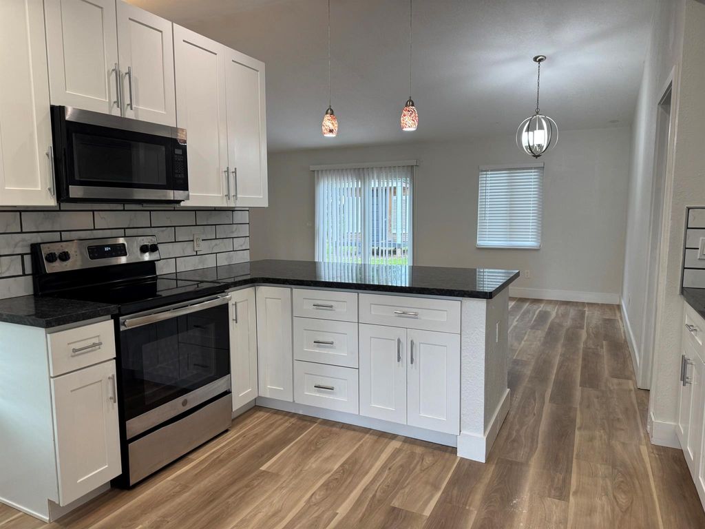 Photo of 3562 SW Rivera Street, Port Saint Lucie, FL 34953 (MLS # R11105088)