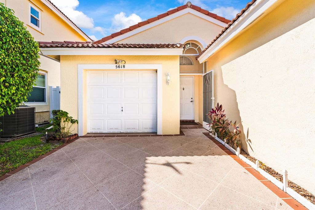 Photo of 5618 Kingsmill Ct, Greenacres, FL 33463 (MLS # R11092765)