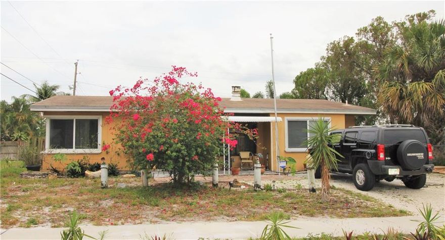 This is a 3 bedroom, 1 bath home in the Highlands of Pompano Beach, and also has 2 additional rooms, one being used as a dining room and one as an office. There is a wood burning stove in the living room. The kitchen also has an additional large space. Big yard includes a vegetable garden! The lot next door is vacant so no neighbors on the east side! The 20x20 tiles are a gorgeous, creamy porcelain!This property is also for sale, see MLS #10013146.
