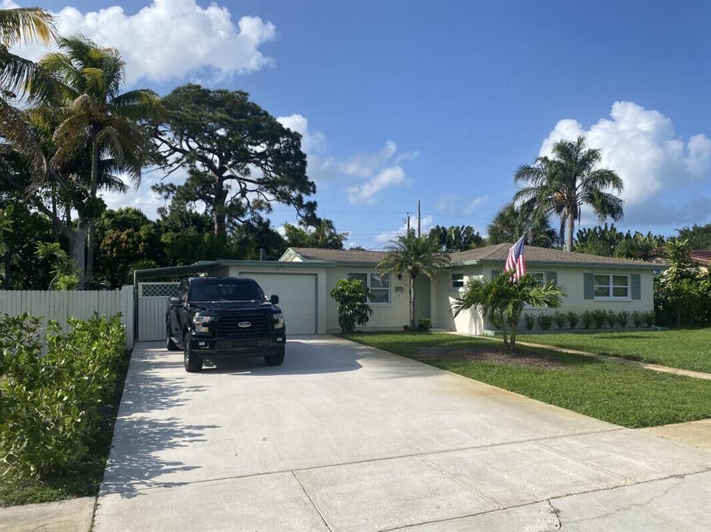 Photo of 837 W Jasmine Drive, Lake Park, FL 33403 (MLS # R10796994)