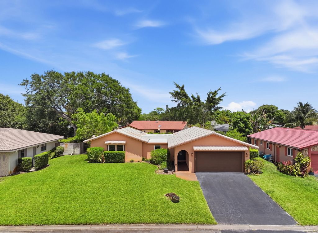 Photo of 8557 Shadow Wood Boulevard, Coral Springs, FL 33071 (MLS # B26021625)