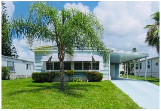 Welcome to this 2bedroom, 2bath, retreat nestled in a safe cul-de-sac! 2025 REFRESHED SIDING! 2024 UPDATES = (2) bathroom vanities & Toilet, 2024 3/4'' Subflooring oak laminate throughout. 2021 AC & 2020 Water Heater. Step into a spacious layout w/ a built-in wet bar, built-in dining buffet & a walk-in master bedroom closet. In-unit laundry adds convenience & the large tool shed offers ample storage. You'll be pleased w/ the prime location; close to the beach, grocery stores, shopping, post office, banks, hospitals & more. Lot lease $930.98 covers Security, Cafe, Clubhouse w/activities, lawn care, trash, private golf course (no fees to play), Bingo, heated pool, pickleball, tennis, shuffleboard, bocce, gym, library, cards, Mahjong, clubs & more!