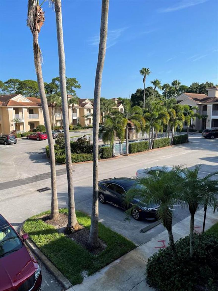 Nicely appointed second floor unit with vaulted ceilings. With great rental potential with the lockout providing the option of renting the whole unit or 2 separate units.  Great seasonal or full time living as well!  Laminate flooring in the living room and bedrooms.  Located on the less congested side/quieter side of the the Golf Villas and just up the street from the PGA's clubhouse.  It has a nice, heated community pool.  HOA fee includes water and sewer, insurance of the buildings exterior, internet, basic cable, exterior painting, lawn care and painting of the exterior.  Also available for use is the PGA Village Clubhouse with an Olympic style pool, billiards, fitness center, tennis, pickle ball, playground and many organized games.