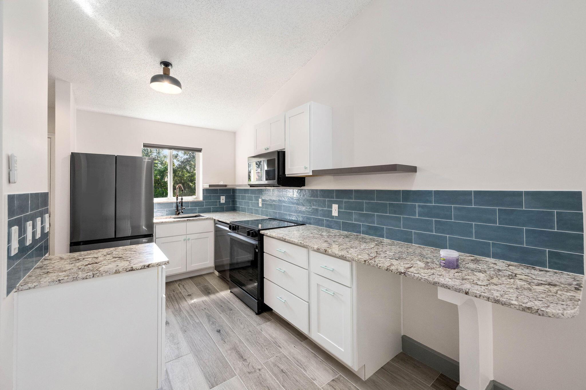 Completely remodeled 3 bedroom 2 bath apartment for rent. New appliances, cabinets floors and bathrooms. Water included in rent. Full size washer and dryer inside unit