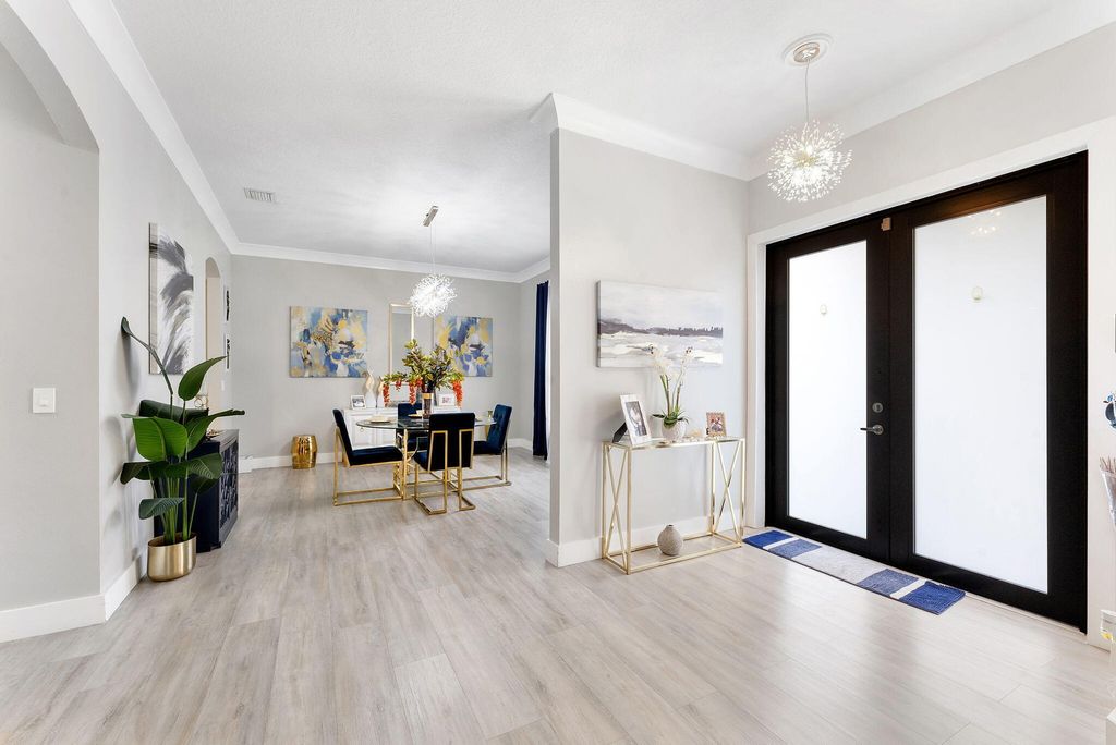 Photo of 123 Bilbao Street, Royal Palm Beach, FL 33411 (MLS # B26018906)