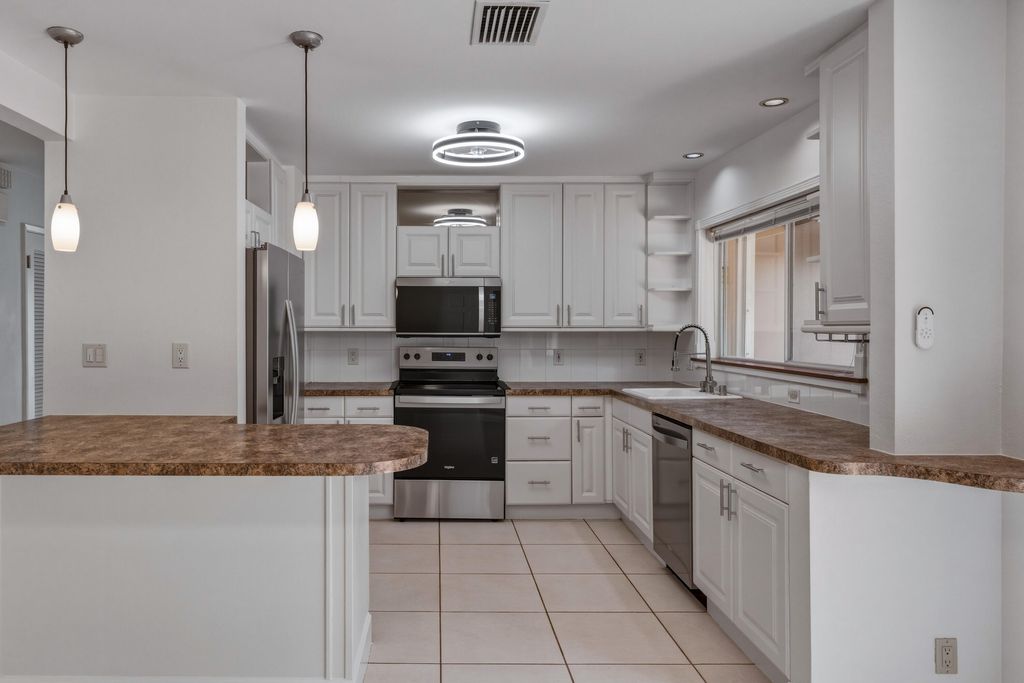 Photo of 284 Allenwood Drive, Lauderdale By The Sea, FL 33308 (MLS # B26027231)