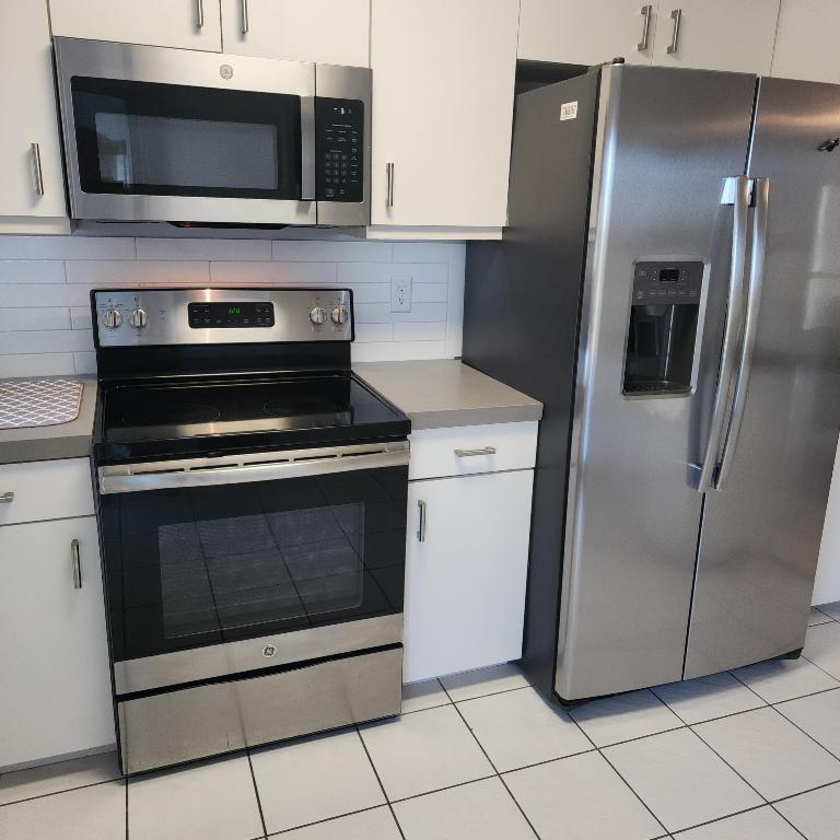 POINCIANA PLACE CONDO A,B AND C - Residential