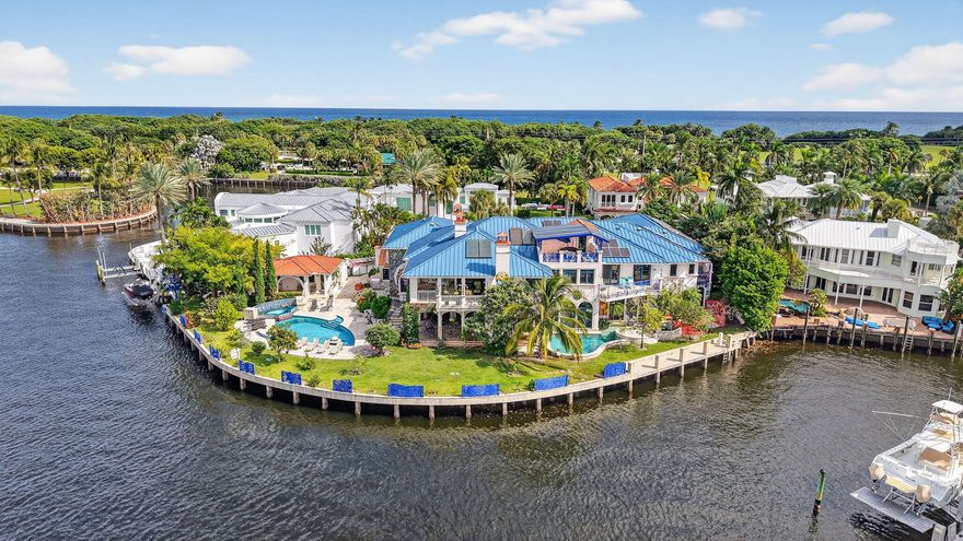PRIME LOCATION! Exceptional crown jewel, one of a kind waterfront estate nestled
on a Barrier Island, quiet Cul-De-Sac surrounded by other trophy properties. X-tra Large, 256 FT., POINT LOT with unobstructed panoramic views of the intracoastal for the most discerning buyer. Timeless architecture and immersive design with artistic vision encompasses 12 bedrooms, 10+bathrooms, 6 fireplaces, 3 resort style private, heated pools, summer kitchen and bar, plus a detached guest suite, all surrounded by lush vegetation, adds
to the charm and value of this home, capturing the energy, making it an
absolute standout. Spectacular French inspired kitchen, walk-in refrigerator and freezer along with an exquisite dining area, allowing you to entertain at ease... A large European influenced master suite with sauna, jacuzzi, a crystal bed and radiant floors, includes spacious balconies with unparalleled, picturesque views. A truly unique and fun property. DEEP WATER frontage, unlimited dockage in a No Wake Zone, makes this is a BOATER'S DREAM! Only a short walk to play Golf and the Beaches...An INVESTMENT opportunity, this property offers an extraordinary world-class lifestyle! 

*Land value alone is worth it! Structures are concrete, including the guest house, both with impact glass, also advantageous. Commercial grade, whole house electric generator with direct access to street natural gas, is another BONUS...