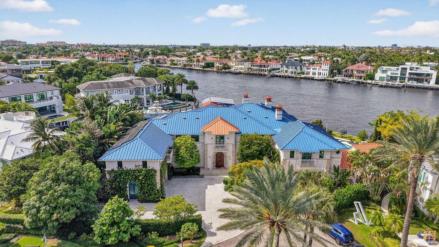 This exceptional crown jewel, one of a kind waterfront estate nestledon a quiet cul-de-sac, exemplifies the finest artisans from around theworld. A trophy point lot, extra-large, with panoramic views of thelntracoastal, embellish ''old world'' craftsmanship for the most discerningbuyer. Timeless architectural character encompasses 12 bedrooms, 10+bathrooms, 6 fireplaces, 3 resort style private, heated pools, summer kitchenand bar, detached guest suite, all surrounded by lush vegetation, addsto the charm and value of this home, capturing the energy, making it anabsolute standout! Spectacular French inspired kitchen, includes awalk-in refrigerator and freezer along with an exquisite dining area,allowing you to entertain at ease. A large European influenced mastersuite.